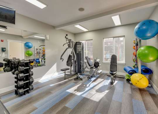 Community Fitness Center with Equipment at Landings at Morrison Apartments located in Gresham, OR.