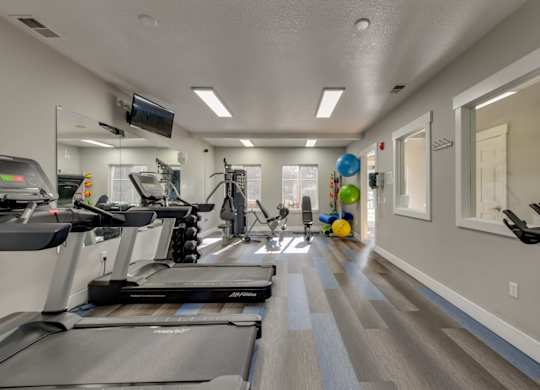 Community Fitness Center with Equipment at Landings at Morrison Apartments located in Gresham, OR.