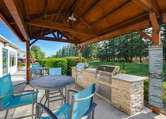 Outdoor BBQ Area with Canopy at Landings at Morrison Apartments located in Gresham, OR.