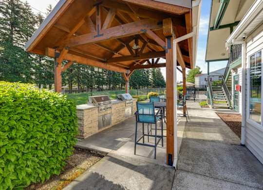 Outdoor BBQ Area with Canopy at Landings at Morrison Apartments located in Gresham, OR.