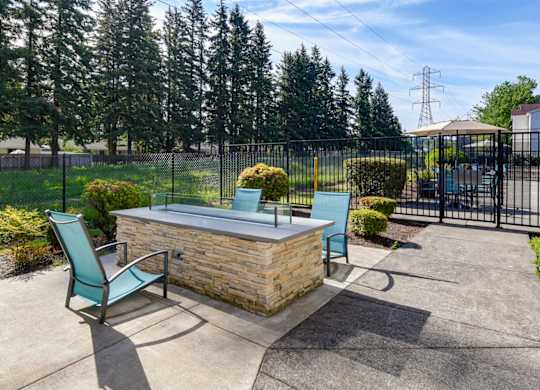 Community Fire Pit Area at Landings at Morrison Apartments located in Gresham, OR.