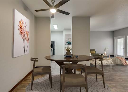 Model Dining Room with Wood-Style Flooring at Landings at Morrison Apartments located in Gresham, OR.