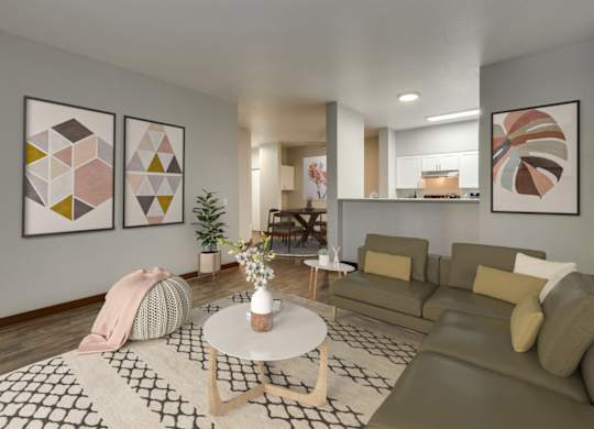 Model Living Room with Wood-Style Flooring and View of Kitchen at Landings at Morrison Apartments located in Gresham, OR.