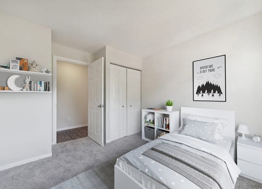 Model Bedroom with Carpet and Hallway View at The Commons at Haynes Farm Apartments in Boston, MA.