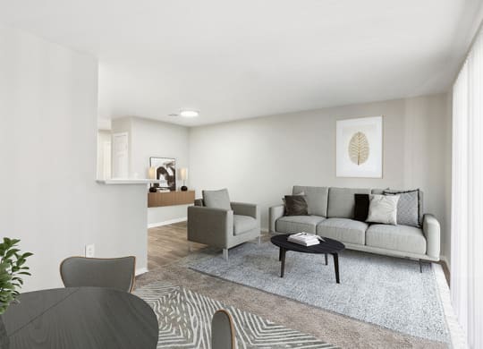 Model Living Room and Dining Room Area with Carpet at Loma Vista Apartments in Las Vegas, NV.