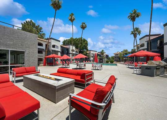 Community Fire Pit Area with Lounge Furniture at Country Club Verandas Apartments located in Mesa, AZ.