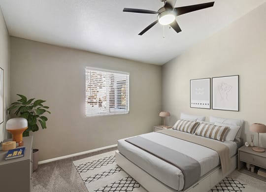 Model Bedroom with Carpet and Window View at Verraso Apartments in Las Vegas, NV.