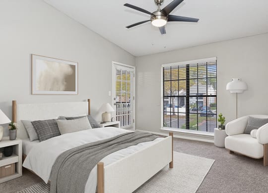 Model Bedroom with Carpet and Window View at Grand Pavilion Apartments in Tampa, FL.