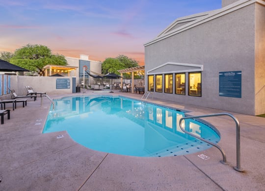 Community Swimming Pool with Pool Furniture at Ridgeline Apartments in Tucson, AZ.