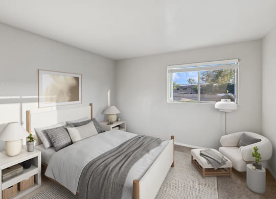 Model Bedroom with Carpet and Window View at Tanque Verde Apartments located in Tucson, AZ.