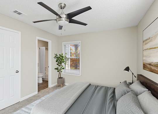 Model Bedroom with Carpet and Attached Bathroom at Element 41 Apartments located in Marietta, GA.