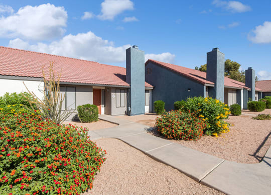 Exterior Community Building and Landscape at Peaks on 4th Apartments in Avondale, AZ.