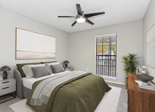 Model Bedroom with Carpet and Window View at Grand Pavilion Apartments in Tampa, FL.