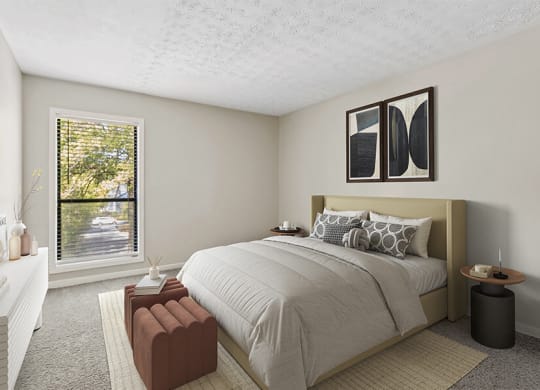 Model Bedroom with Carpet and Window View at Lakeside Retreat Apartments located in Peachtree Corners, GA.