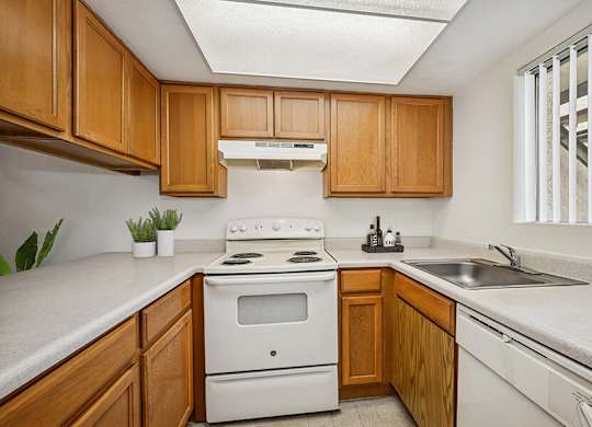 Model Classic Kitchen with Tile Flooring at Butler Ridge Apartments located in Glendale, AZ.