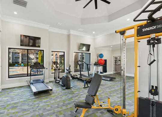 Community Fitness Center with Equipment at Shadow Ridge Apartments in Riverdale, GA.