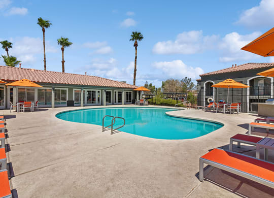 Community Swimming Pool with Pool Furniture at Loma Vista Apartments in Las Vegas, NV.