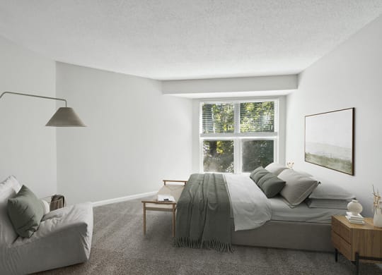 Model Bedroom with Carpet and Window View at Arbor Village Apartments located in Charlotte, NC.