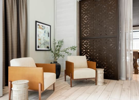 Lounge area with two chairs and decorative vase