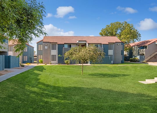 Exterior Community Building and Landscape at Peaks on 4th Apartments in Avondale, AZ.
