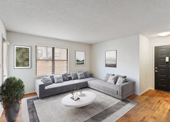 Model Living Room with Wood-Style Flooring at Grandstand Apartments in Marietta, GA.