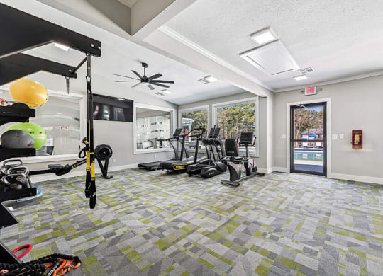 Community Fitness Center with Equipment at Paramont Apartments in Duluth, GA.