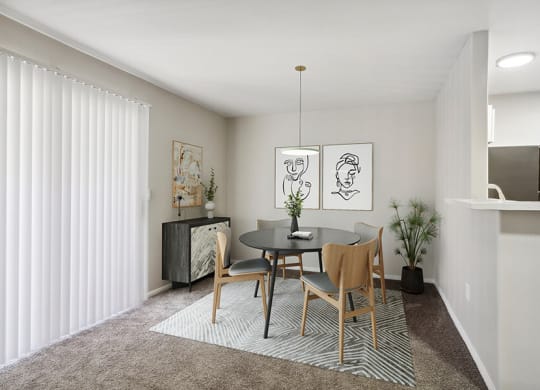 Model Dining Room with Carpet at Loma Vista Apartments in Las Vegas, NV.