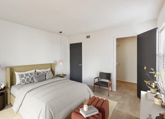 Model Bedroom with Carpet and Walk In Closet at Grandstand Apartments in Marietta, GA.