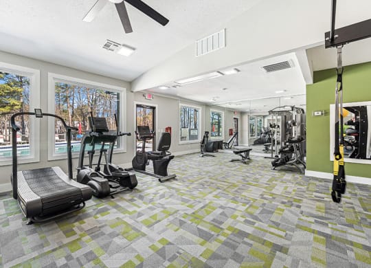 Community Fitness Center with Equipment at Paramont Apartments in Duluth, GA.