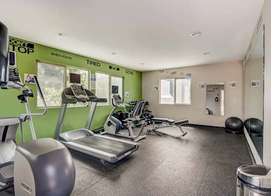 Community Fitness Center with Equipment at Cove La Mesa Apartments located in La Mesa, CA.