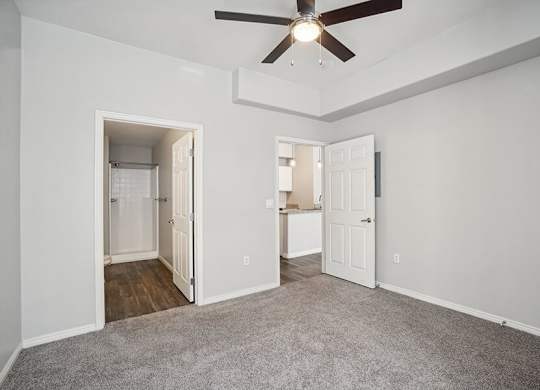 Model Bedroom with Carpet and attached Bathroom at Altitude on Fifth Apartments located in Salt Lake City, UT.