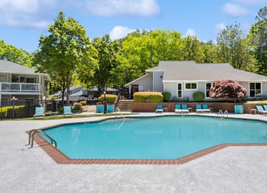 Community Swimming Pool with Pool Furniture at Dunwoody Village Apartments in Atlanta, GA.