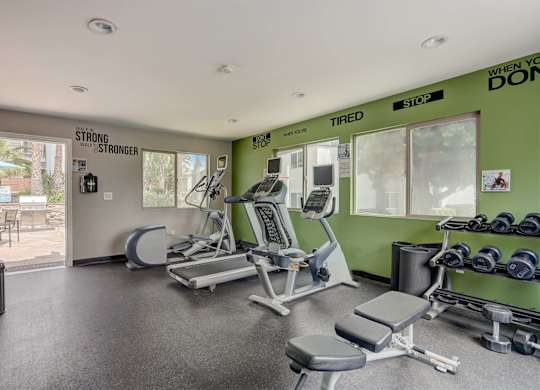 Community Fitness Center with Equipment at Cove La Mesa Apartments located in La Mesa, CA.