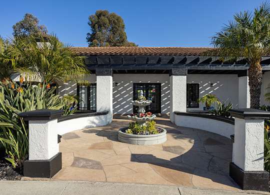 Exterior Community Building with Fountain and Landscape at Santa Fe Ranch Apartments located in Carlsbad, CA.