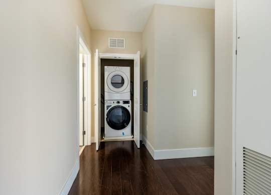 A laundry room with a washer and dryer in it.