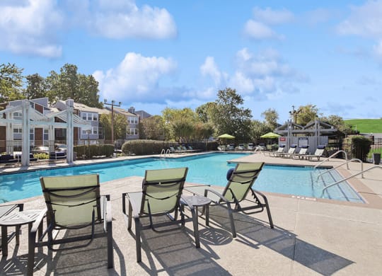 Community Swimming Pool with Pool Furniture at Abbington Heights Apartments in Antioch, TN.