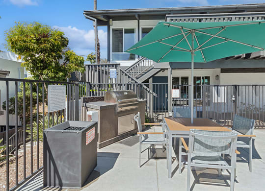 Outdoor BBQ Area with Furniture at Colonnade at Fletcher Hills Apartments in El Cajon, CA.