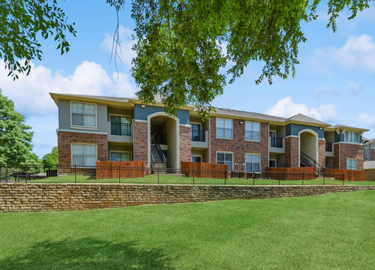Exterior Community Building and Landscape at Belmont at Duck Creek Apartments in Garland, TX.
