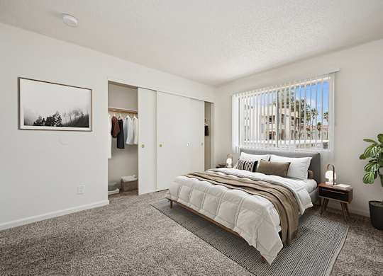 Model Bedroom with Carpet and Large Closet at Butler Ridge Apartments located in Glendale, AZ.