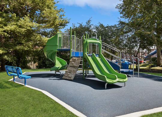 Community Playground with Two Slides at Middlesex Crossing Apartments located in Billerica, MA.