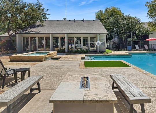 Community Swimming Pool and Fire Pit Area at Summit Ridge Apartments located in Arlington, TX.