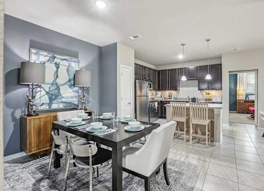 Model kitchen with a dining table set for four.