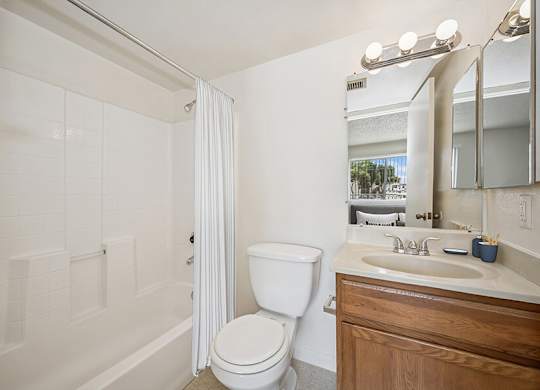 Model Classic Bathroom with Tile Flooring and Shower/Tub at Butler Ridge Apartments located in Glendale, AZ.