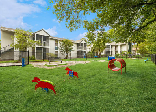 Dog park with agility equipment at Vue at Baymeadows Apartments in Jacksonville, Florida