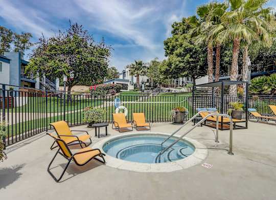 Community Hot Tub with Lounge Furniture at Cove La Mesa Apartments located in La Mesa, CA.