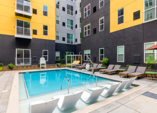 Swimming pool with lounge chairs surrounding
