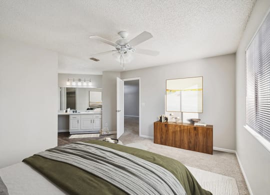 Model Bedroom with Carpet and attached Bathroom at Westland Park Apartments in Jacksonville, FL.