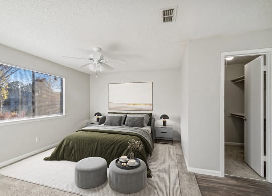 Model Bedroom with Carpet and Walk in Closet at Westland Park Apartments in Jacksonville, FL.
