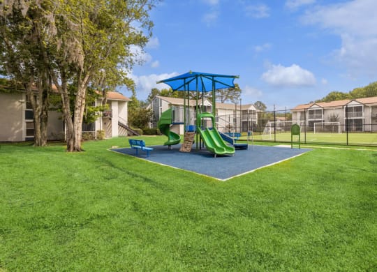 Playground with sun cover at Vue at Baymeadows Apartments in Jacksonville, Florida