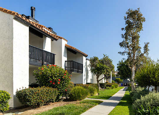 Exterior Community Building with Landscape at Santa Fe Ranch Apartments located in Carlsbad, CA.